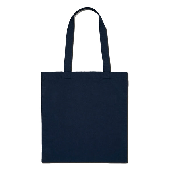 the back of a navy blue tote bag which is blank on a white background