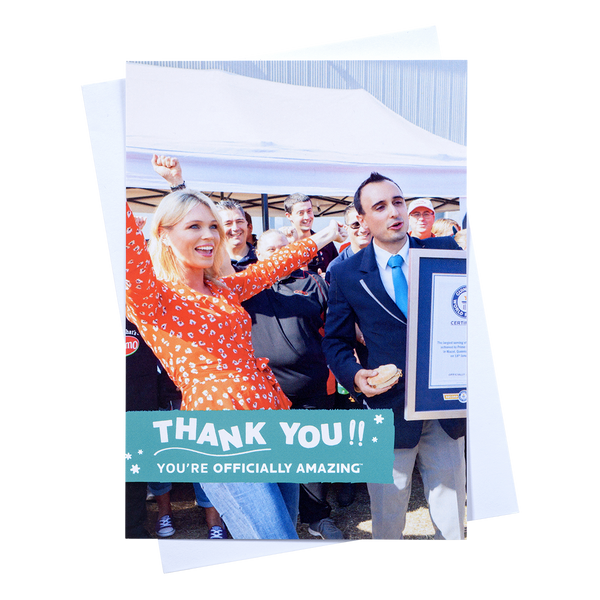 an a5 portrait thank you post card with a holding image of someone celebratin their new world record with envelope