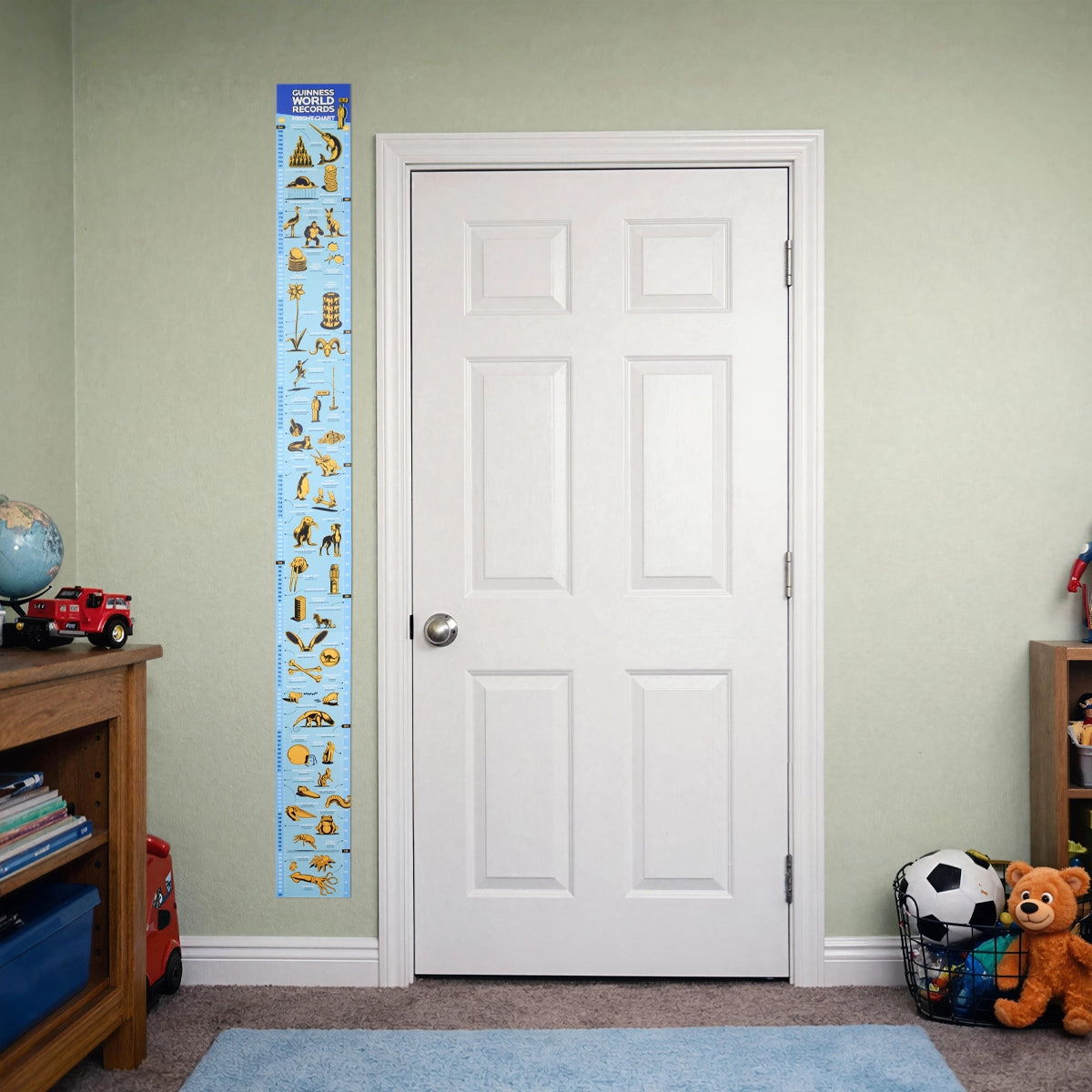 Guinness World Records height chart in a green boys bedroom 