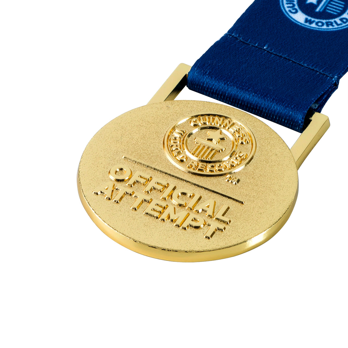 close up image of an medallion featuring the 'Official Attempt' logo embossed on one side.