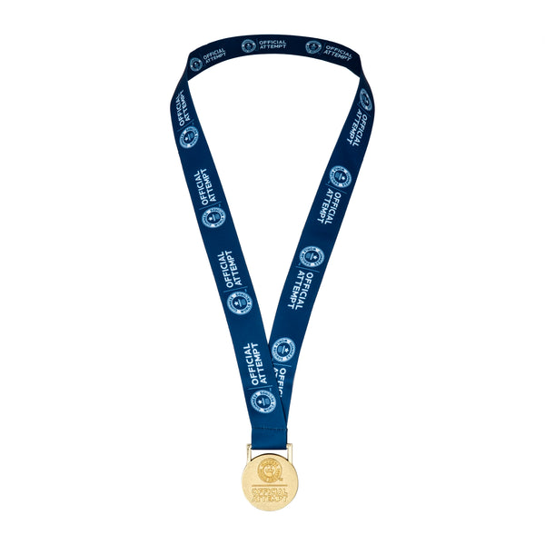 An official attempt medallion with a navy blue lanyard, featuring the 'Official Attempt' logo embossed on one side.