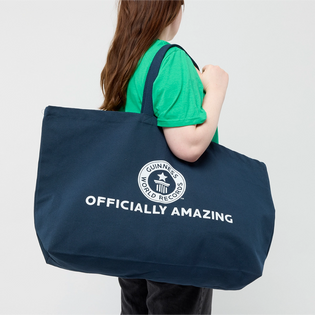 Large navy cotton Guinness World Records tote bag with logo on model 