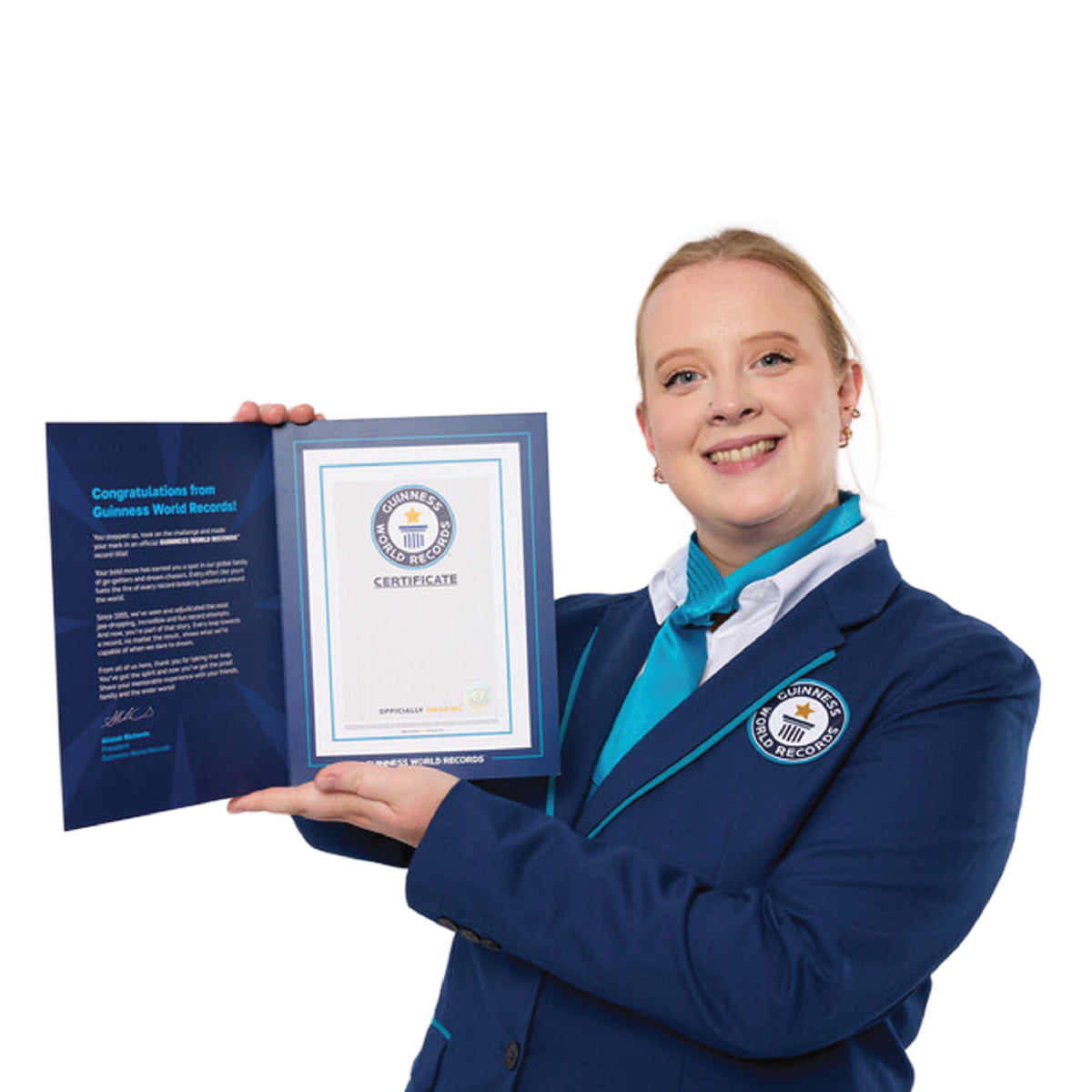 female adjudicator in a Guinness World Records uniform holding a Record Participant Certificate in it's folder with a white background