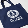 Navy blue tote bag with Guinness World Records logo and Officially Amazing text on a diagonal flatlay